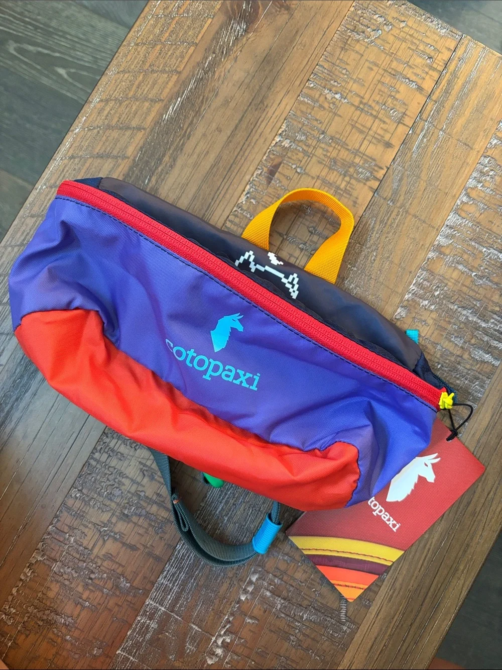 cotopaxi Waist Pack in Purple, Red & Yellow - Picture 1 of 5